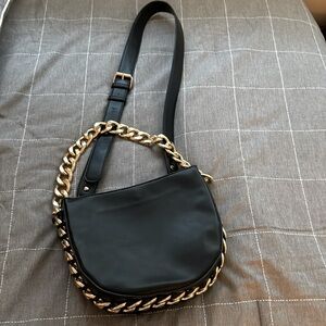 Black crossbody bag with thick gold chain